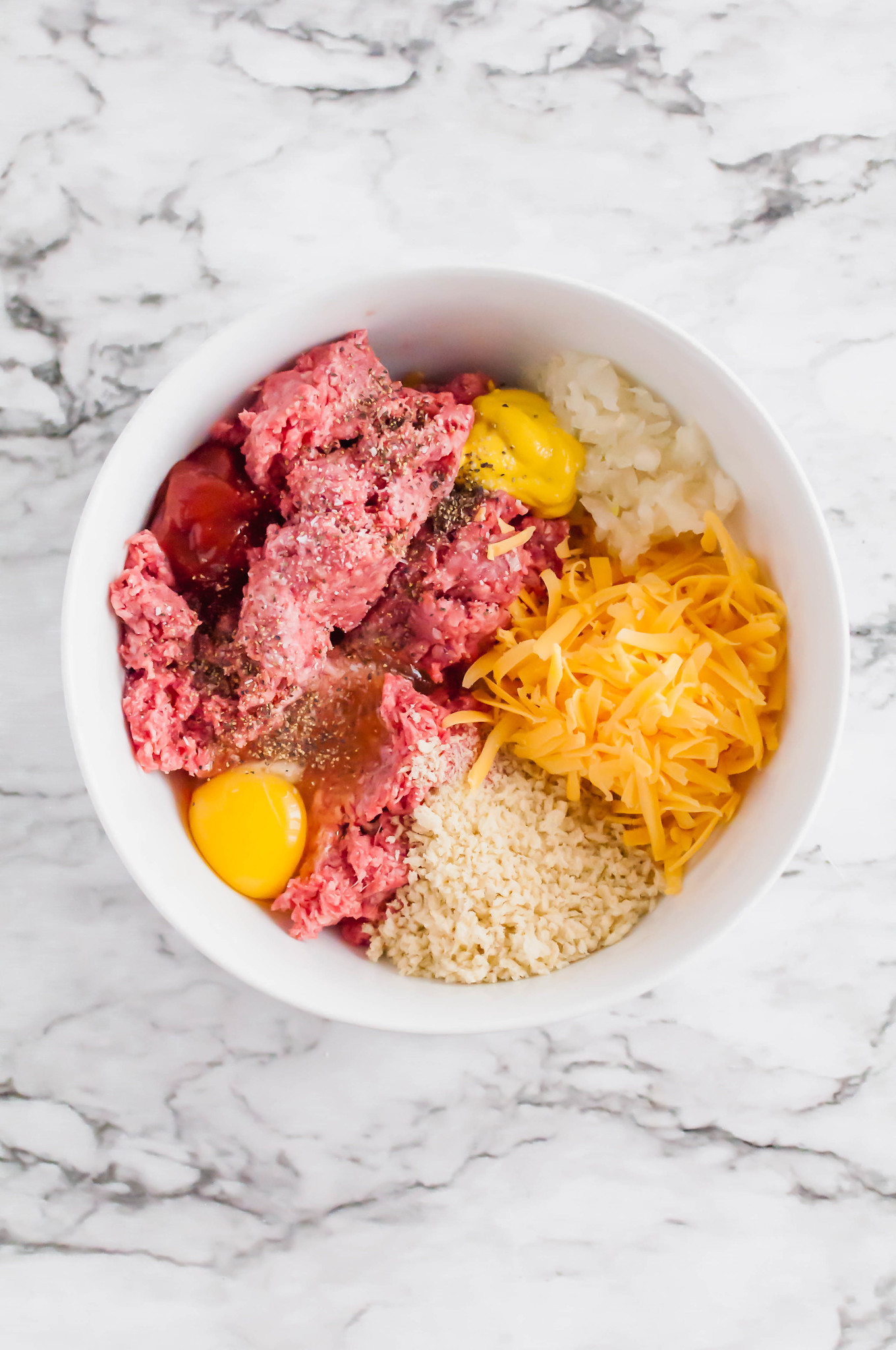 All the glorious flavors of a cheeseburger packed into an easy, weeknight friendly Cheeseburger Meatloaf. It's sure to become a family favorite.