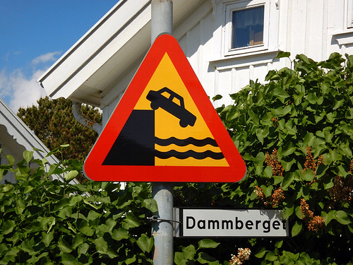 Dangerous driving sign on Dammberget road on the dock in Grundsund on the Bohuslan Coast of Sweden