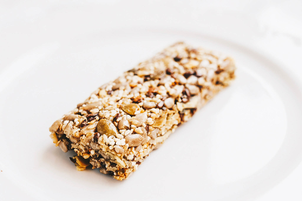 Close Up Food Photo of Healthy Cereal Bar on a White Plate