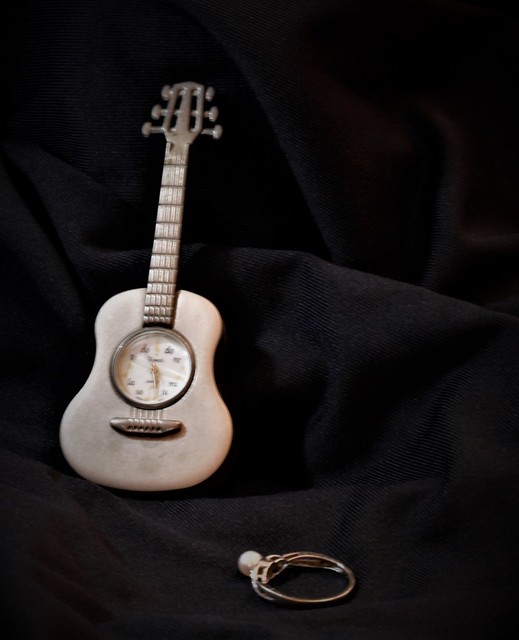 things I love...my pearl ring and mini guitar clock