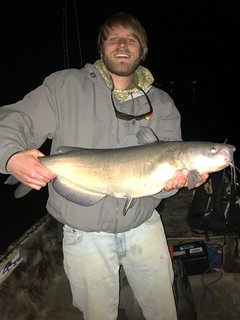 Photo of man holding a big channel catfish