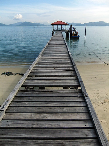 Wharf leading to a pavilion on a beach in Pangkor, Malaysia