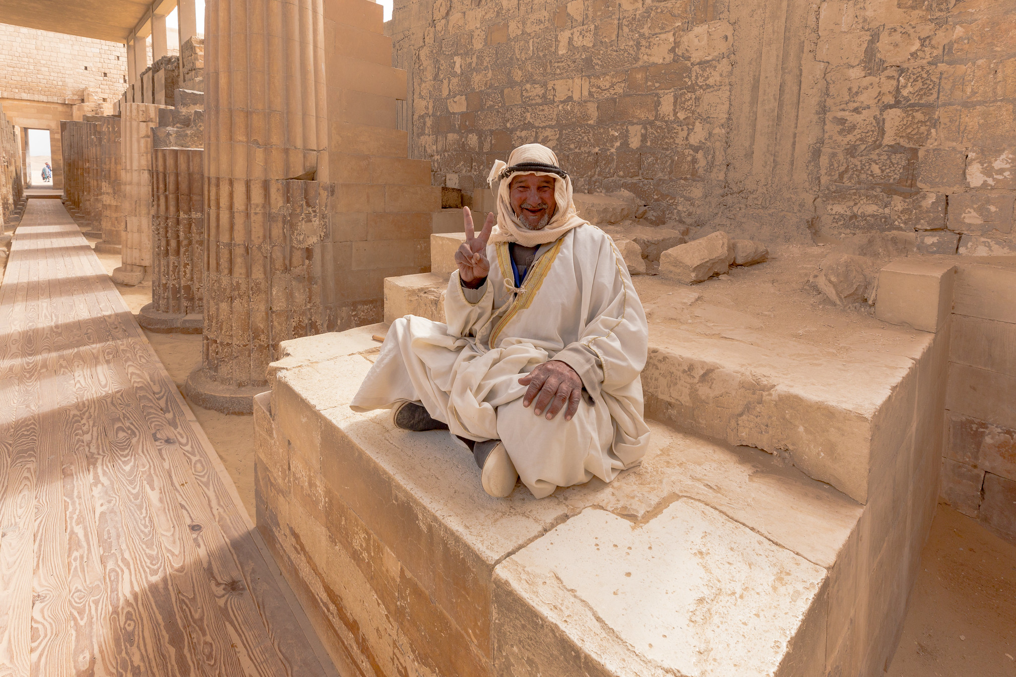Friendly Egyptian man at the Djoser roofed colonnade corridor complex