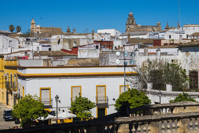A photo of the old town of Jerez de la Frontera. There are many white houses built very narrow next to each other, going uphill