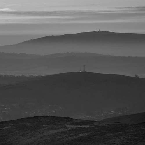 sunrisechurchstrettonlongmynd mist misty hills layers sky golden blue heather cloud view landscape isolation lonely monochrome black white
