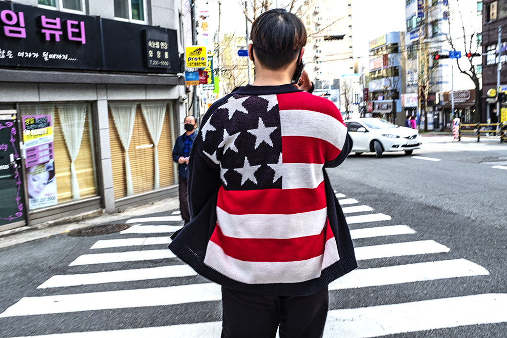 Young man in American flag sweater in Seodaesin-dong--Busan