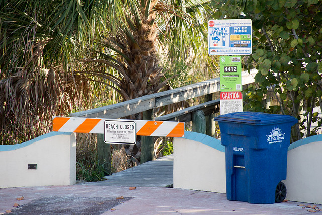 A sign says that a beach is closed near Tampa, Florida