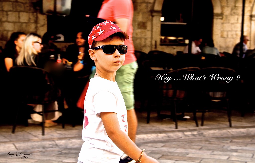 IN DUBROVNIK, CROATIA, THIS YOUNG BOY EXPRESSION WAS TELLING ME !   HEY  WHAT'S WRONG WITH YOU ?