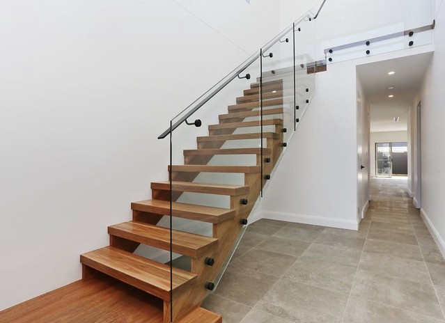 Solid saw cut stringer staircase by Timber Floors Pty Ltd