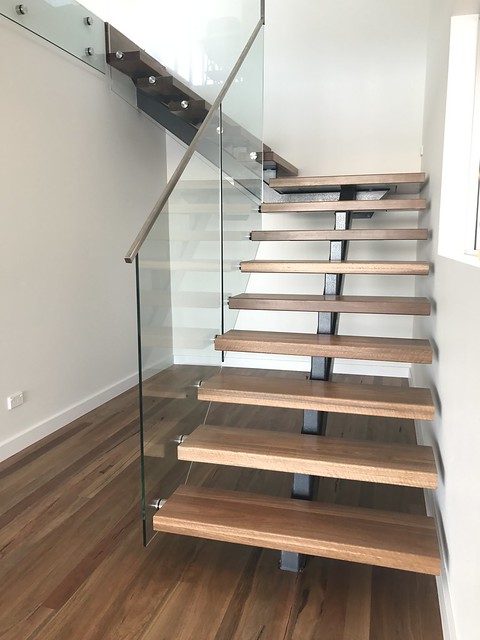 Steel monostringer spine staircase by Timber Floors Pty Ltd