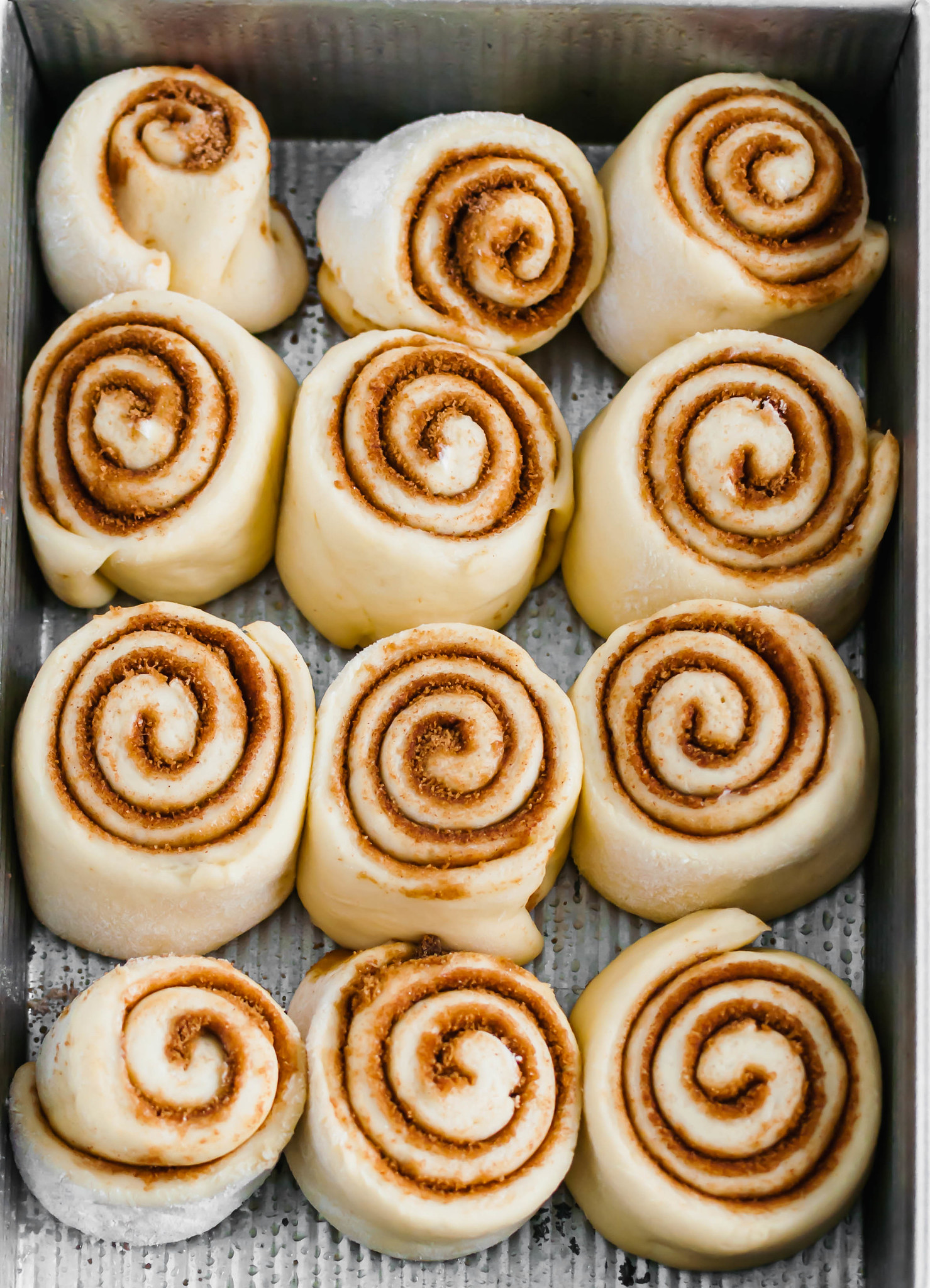 Making you own Copycat Cinnabon Cinnamon Rolls is easier than you may think. You're only a few basic ingredients and 3 hours away from the most delicious cinnamon rolls. Let's get baking.