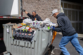 employees loading food into the truck