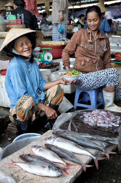Happy fish seller at Hoi An market - Vietnam