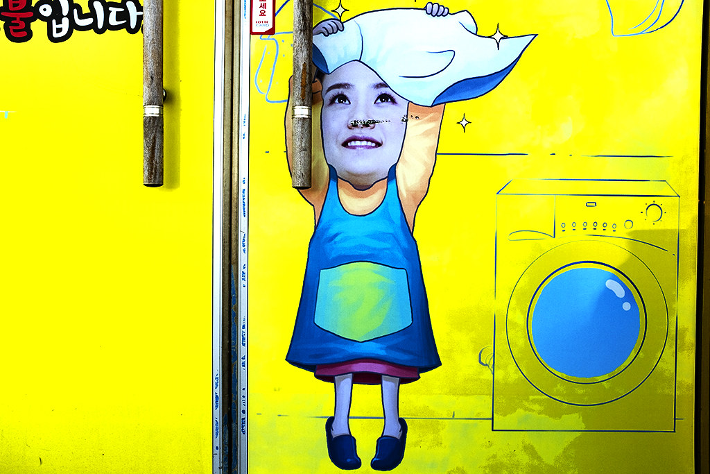 Image of woman fluttering a T-shirt--Tongyeong