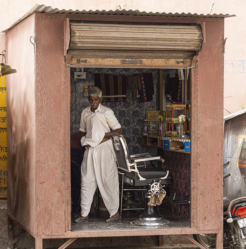 pushkar india desert rajasthan people box hairstyle barber shop man