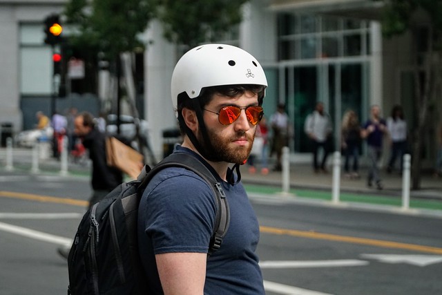 Commuter on a motorized skateboard, South of Market, San Francisco