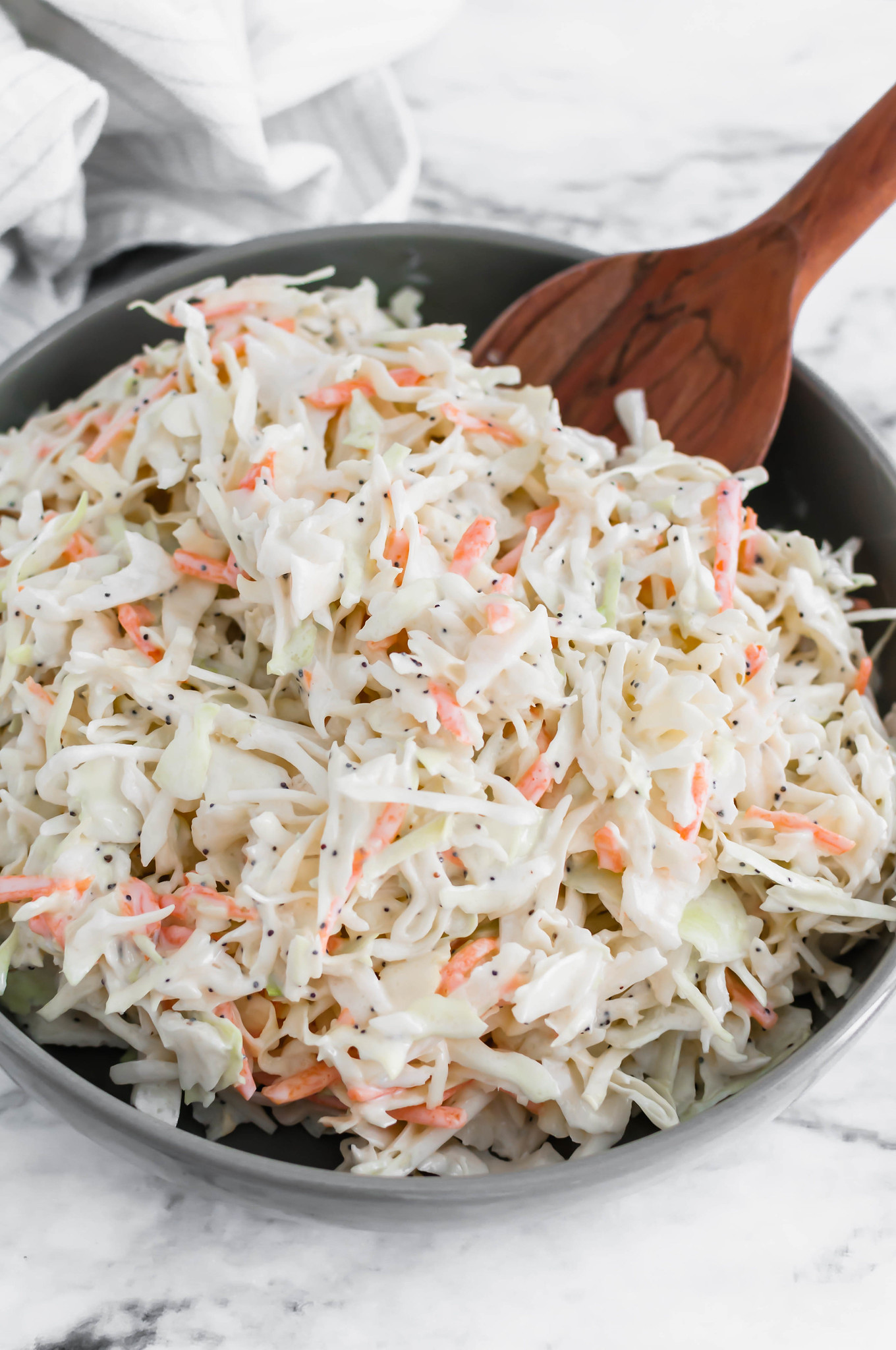 This Creamy Coleslaw is perfect for weeknights, holidays, potlucks and so much more. Made with coleslaw mix and pantry and refrigerator staples.