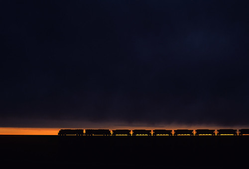 bnsf coaltrain unittrain silhouette sunset storm stormclouds bill powderriverbasin wyoming train railroad locomotive emd sd70mac wy he