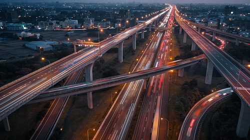 junction interchange intersection overpass transport transportation traffic network concept night view scene scenery scape nighttime highway high speed road taoyuan taiwan motion moving movement aerial birds eye drone architecture building landscape long exposure fly flight angle top down cityscape business real estate car cross crossroad evening dusk