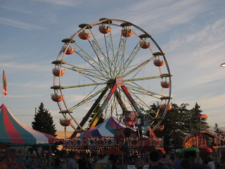 Ferris wheel and cirrus clouds at sunset