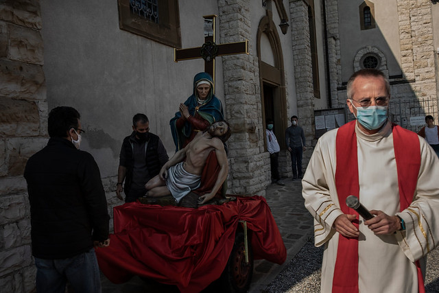 The Rev. Claudio Del Monte preparing for a private Good Friday on April 10 2020 procession in Bergamo, Italy / Fabio Bucciarelli for The New York Times