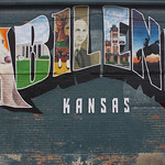 Abilene KS This mural is next to Little Ike Park in downtown Abilene. It was painted in 2018 or 2019 by Whitney Kerr III and Chase Hunter as part of a bigger Abilene mural project. There is a walking tour map of the murals, but I couldn&#039;t find an online copy.