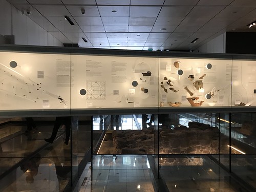 Glass Floor and artifacts with descriptions Inside Where Montreal Began. From History Comes Alive at Montréal’s Pointe-à-Callière
