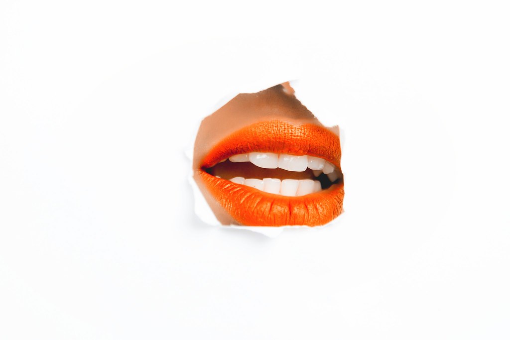 Photography of woman orange lip - Credit to https://homegets.com/