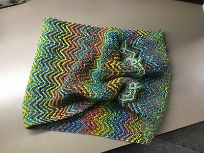 Nicole (mamaboj) modified the ZickZack Scarf by Christy Kamm that she was knitting as a gift into a cowl. Knit using Schoppel Wolle Zauberball