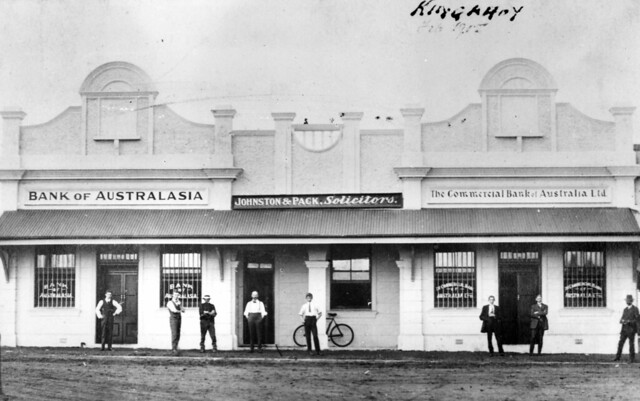 Staff in front of the Commercial Bank Johnston & Pack Solicitors and the Bank of Australia Ltd, Kingaroy ca.1915