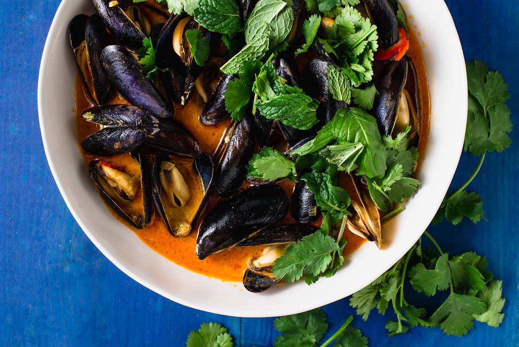 Steamed coconut curry mussels layered with Thai inspired flavors of red curry paste, ginger, garlic garlic and creamy coconut milk.
