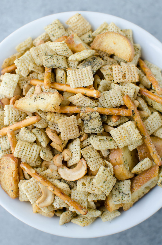 Dill Pickle Chex Mix - my alltime favorite Chex Mix! Chex cereal, bagel chips, pretzel sticks, and cashews coated in a buttery dill pickle and ranch seasoning and baked until crispy and delicious. 