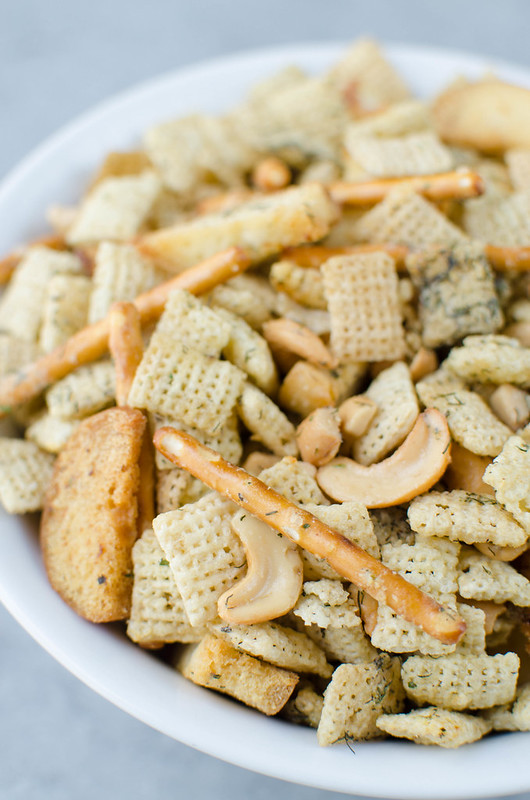 Dill Pickle Chex Mix - my alltime favorite Chex Mix! Chex cereal, bagel chips, pretzel sticks, and cashews coated in a buttery dill pickle and ranch seasoning and baked until crispy and delicious. 