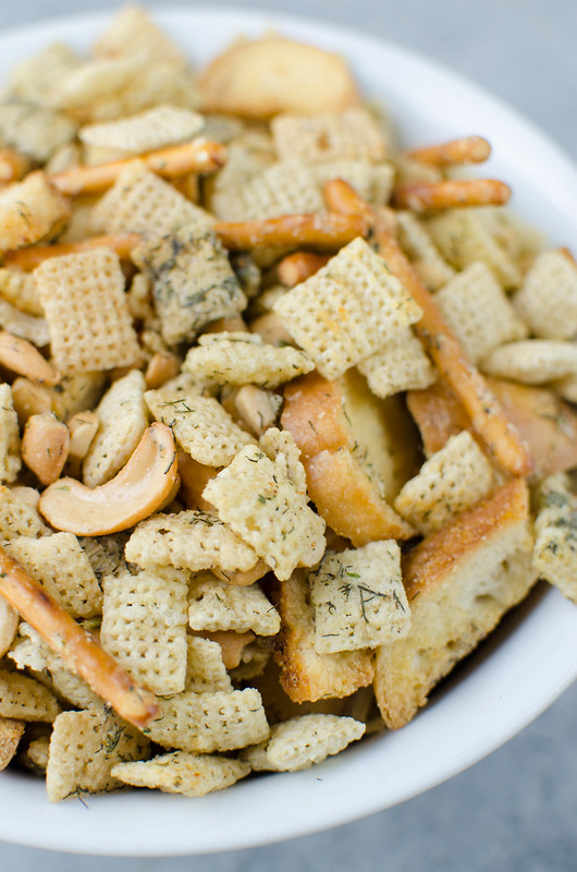Dill Pickle Chex Mix - my alltime favorite Chex Mix! Chex cereal, bagel chips, pretzel sticks, and cashews coated in a buttery dill pickle and ranch seasoning and baked until crispy and delicious. 