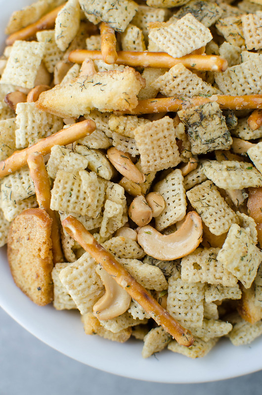 Dill Pickle Chex Mix - my alltime favorite Chex Mix! Chex cereal, bagel chips, pretzel sticks, and cashews coated in a buttery dill pickle and ranch seasoning and baked until crispy and delicious. 