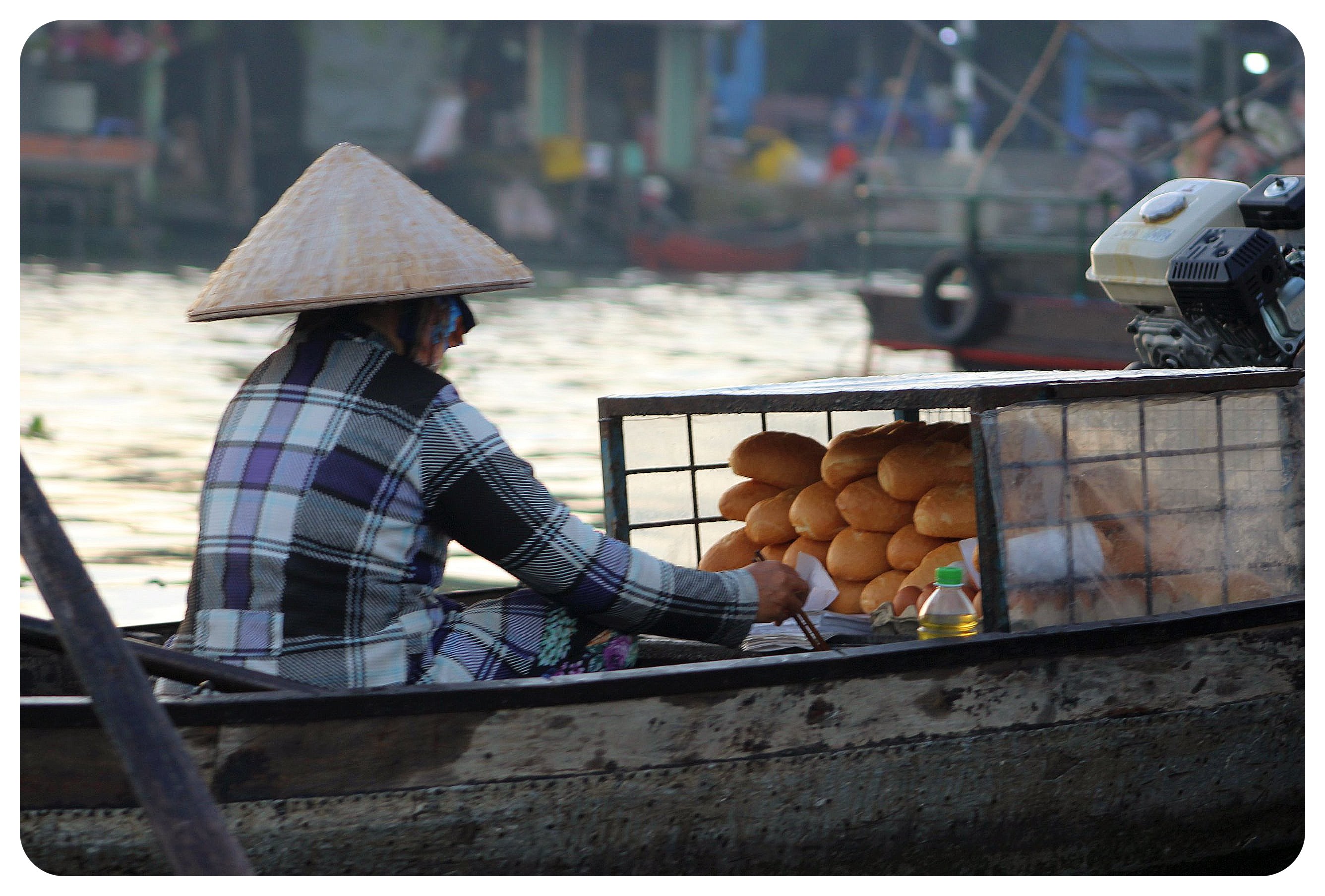 mekong delta floating banh mi vendor