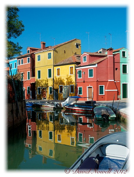 Isola de Burano, near Venice, Italy. Beautiful vivid colours and reflections in summer.
