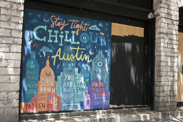 As businesses board-up in downtown Austin, street artists add color.