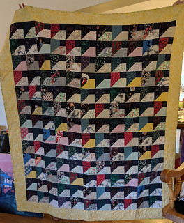 Many months after finally salvaging the pieces saved from the fire into two (!) quilts, one for each of their daughters, I got a photo of one of them.

Details: domesticat.net/quilts/phoenix