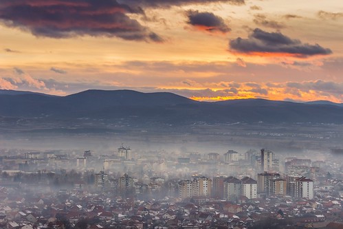sunset pirot serbia city cityscape town mist fog haze smog sunrise golden orange clouds sky mountains horizon buildings downtown view viewpoint vantage point weather misty moody pollution
