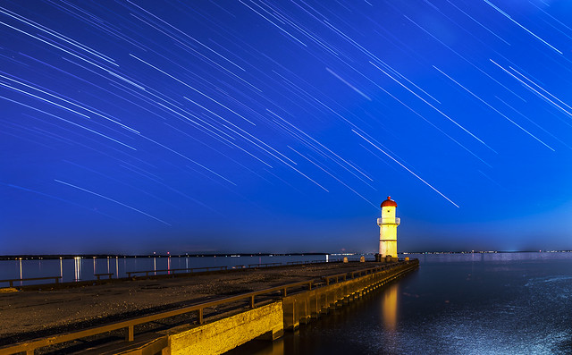 lachine lighthouse and star trails by eva blue 01