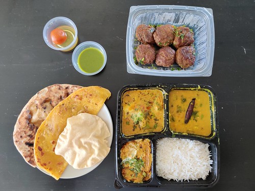 Clockwise from top: Gosht Galawat Kebab, Non-Vegetarian Set Meal, Ulte Tawe Ka Paratha
