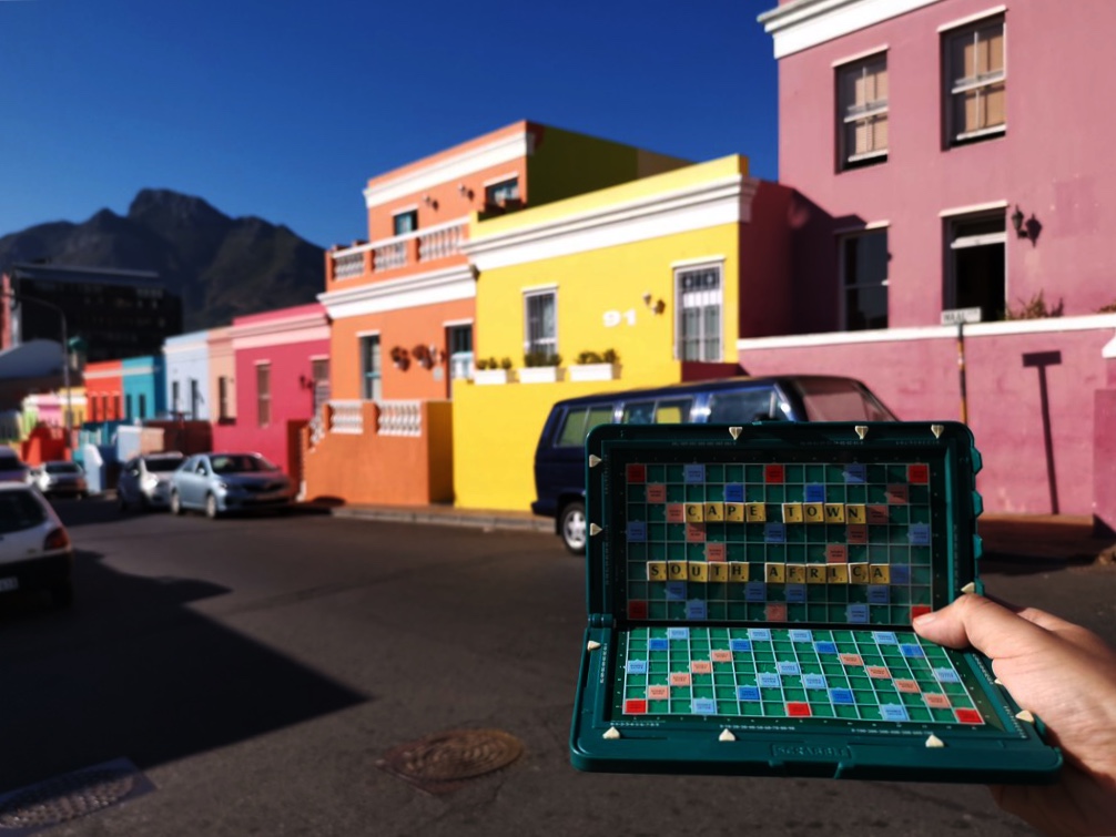 Scrabble set with Cape Town South Africa formed in front of colourful houses in Bo Kaap, Cape Town