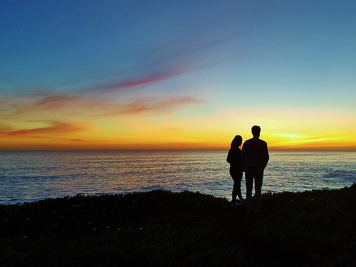 ocean view couple love romance sunset california photography twilight beauty nature together sharing appreciation invinity horizon looking peace moonjazz awe wonder sky tranquil calm male female silhouette