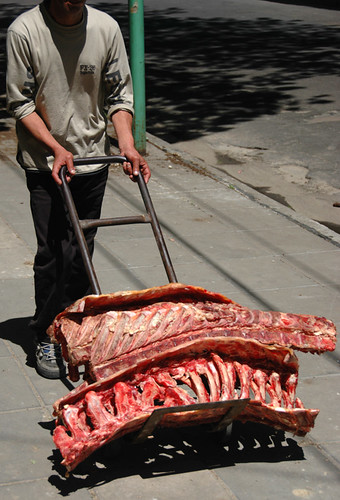 Wheeling in the carne for a parrillada in a restaurant in Buenos Aires, Argentina