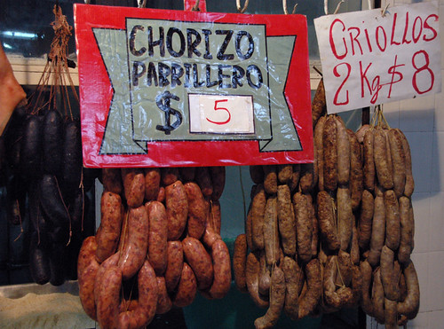 Carne in the form of blood, chorizo and criollo sausages for a parrillada BBQ hanging in the market in Tucaman, Argentina