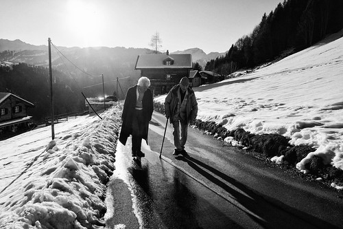 schuders schiers switzerland grison graubünden alps swissalps mountain village road street streetphotography walk hike people silhouette peoplesilhouette personsilhouette day clear sun sunset outdoor lightsandshadows light shadow perspective leadinglines monochrome blackandwhite sony sonya6000 a6000 selp1650 1xp raw photomatix hdr qualityhdr qualityhdrphotography fav100