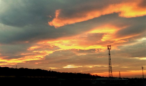 cameraphone tyneandwear tyneyard sunset powerlines lightingtower clouds sky railwayyard lamesley gateshead northeast