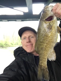 Photo of Man holding a smallmouth bass