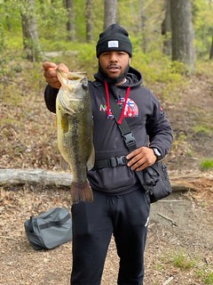 Photo of man holding a largemouth bass
